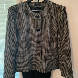 Ladies Houndstooth silk-lined jacket and black sleek skirt